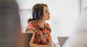Brunette lady looking in front of her presented to